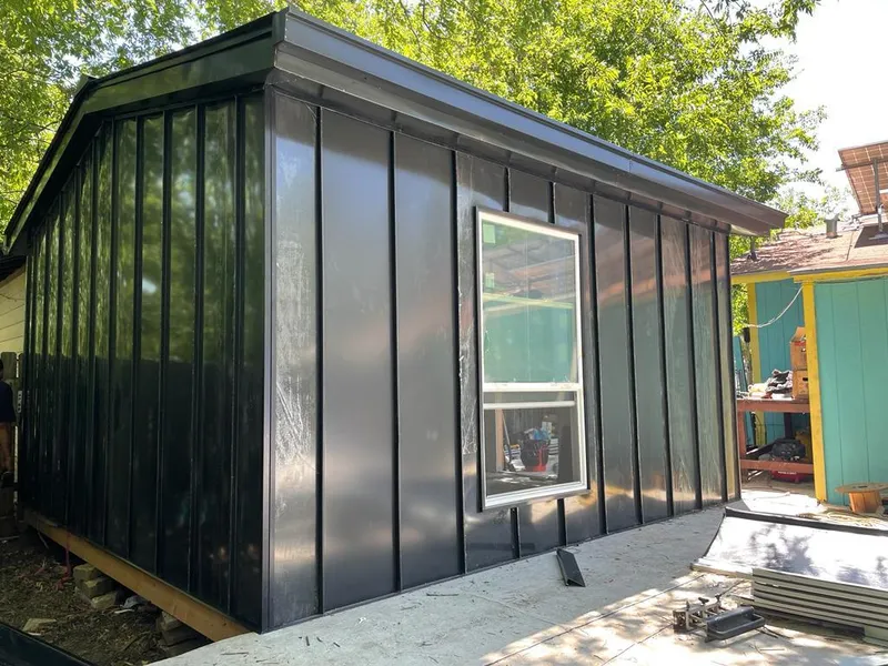 Black standing seam metal wall panels for Roof Inspection in Gladeview