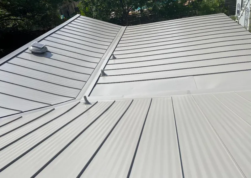 Solar attic fan installed on a metal roof for Roof Ventilation in Gladeview